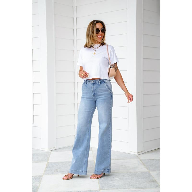 Risen High Rise Light Wash Wide Leg Jeans with Slanted Pockets