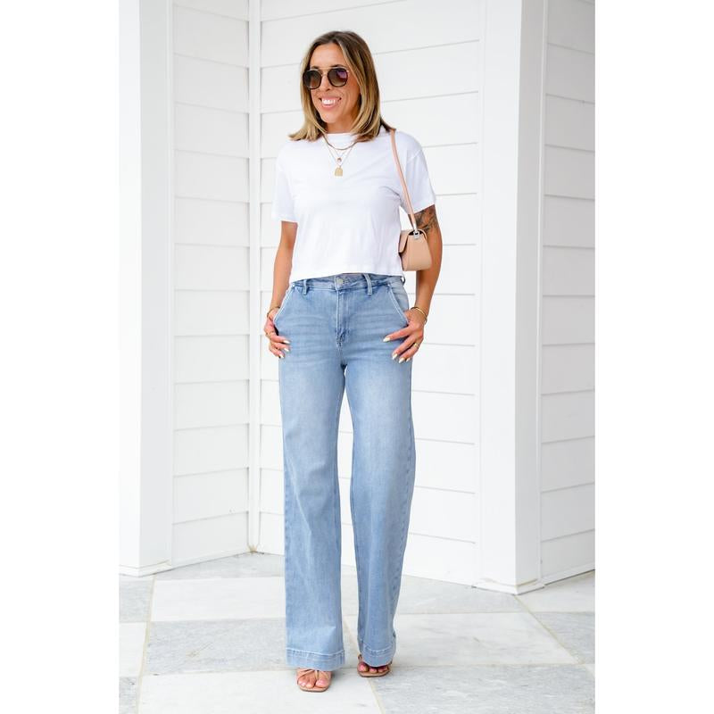 Risen High Rise Light Wash Wide Leg Jeans with Slanted Pockets