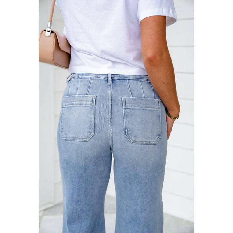 Risen High Rise Light Wash Wide Leg Jeans with Slanted Pockets