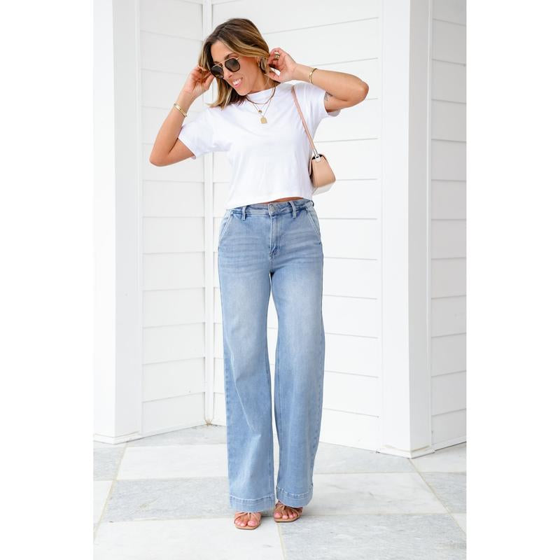 Risen High Rise Light Wash Wide Leg Jeans with Slanted Pockets
