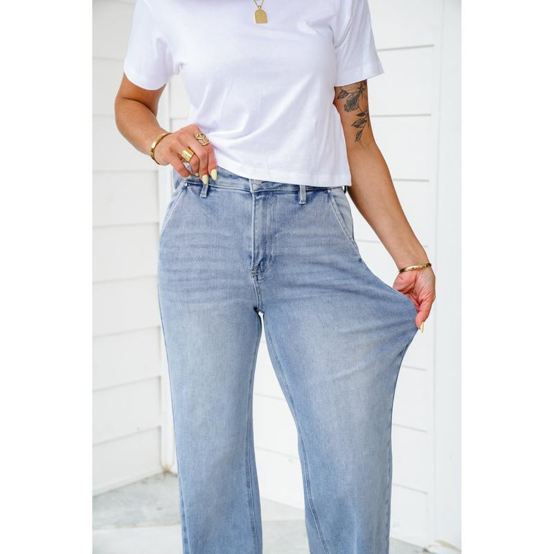 Risen High Rise Light Wash Wide Leg Jeans with Slanted Pockets